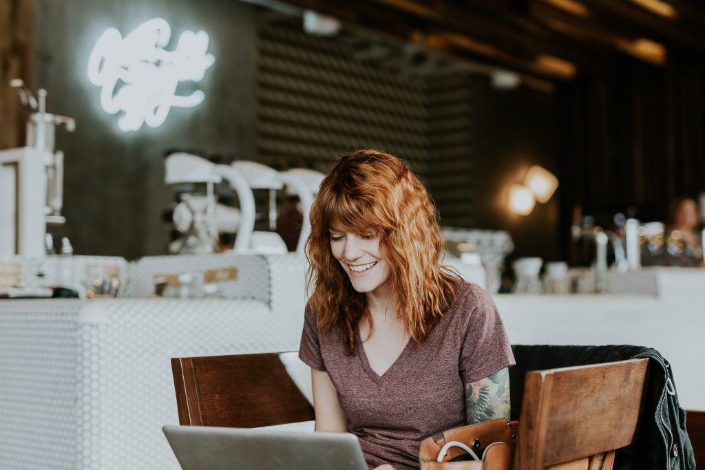 woman on laptop smiling